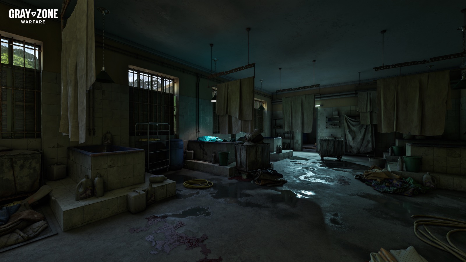 Inside the Asylum in Gray Zone Warfare, a dim tiled wash room with hanging sheets, stone tubs and a wet floor