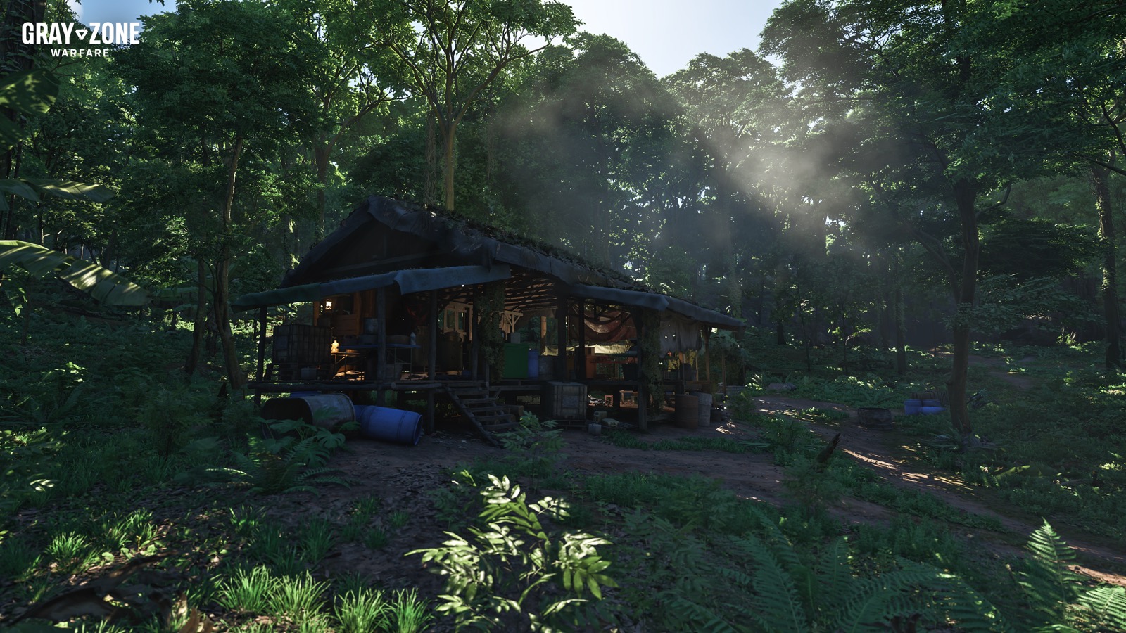 Official Rogue Ops still of a jungle shack on stilts, with barrels and a covered porch in the trees.